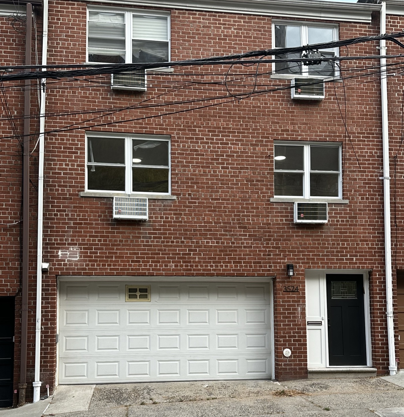 Brick townhouse with a two-car garage, Bronx